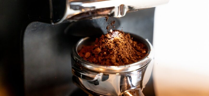 Coffee,Grinder,With,Portafilter,And,Ground,Coffee,Black,And,Silver